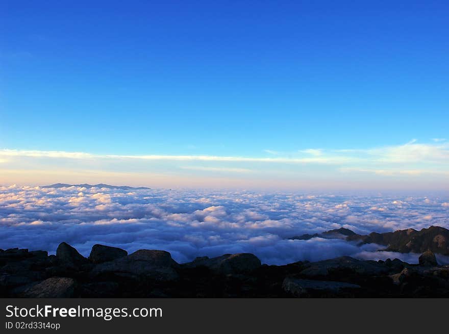 Scenery of the sea clouds on the top of mountains at sunrise. Scenery of the sea clouds on the top of mountains at sunrise