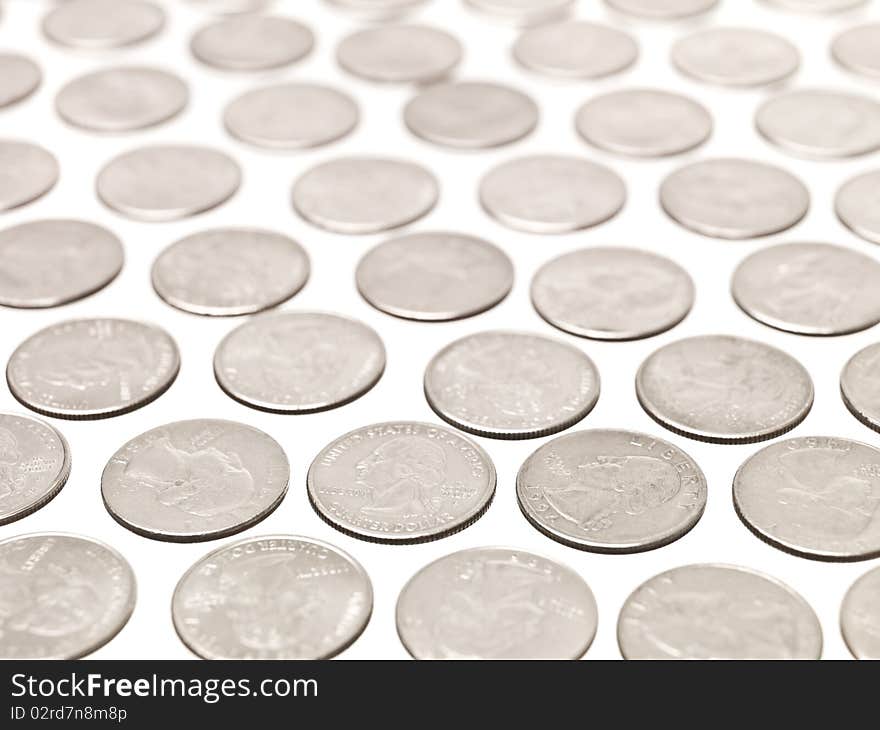 Arranged Quarter coins on white background