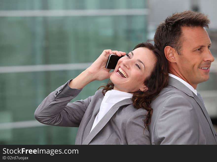 Business partners with mobile phone. Business partners with mobile phone