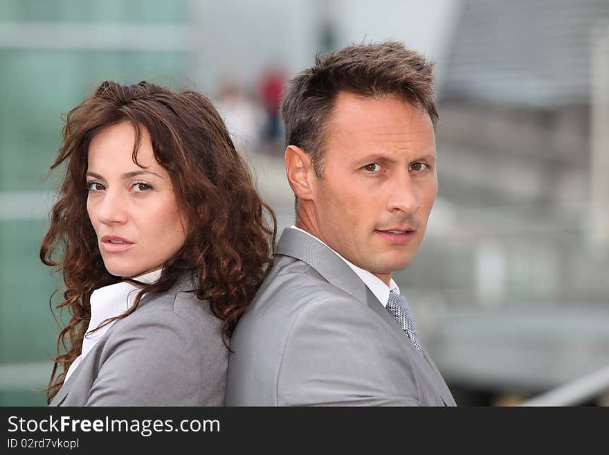 Portrait of business partners standing outside. Portrait of business partners standing outside