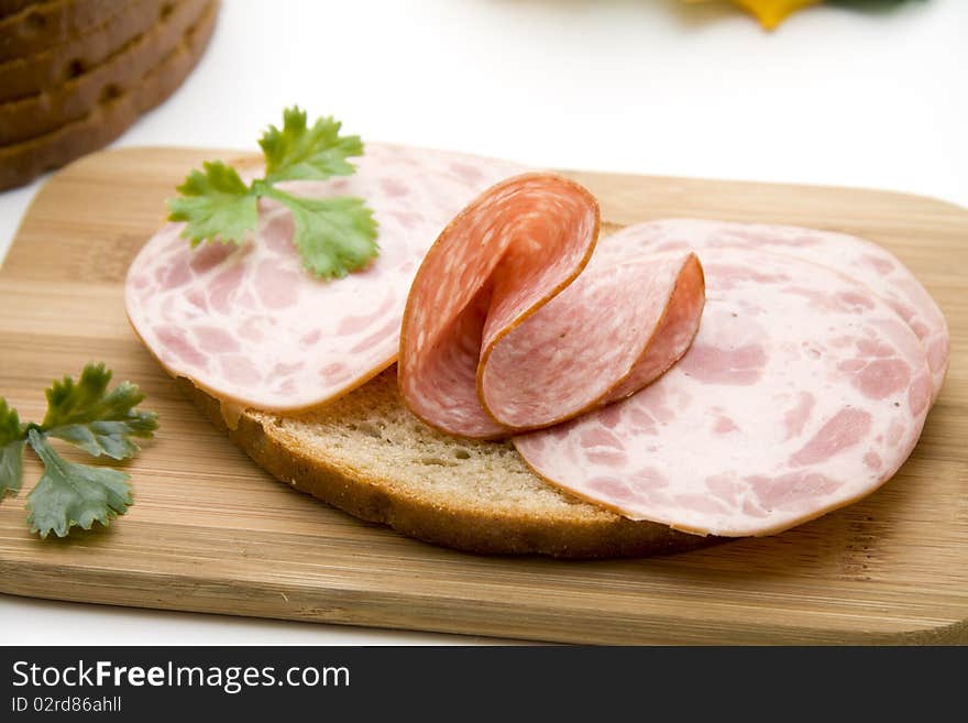 Wheat bread with sausage and parsley