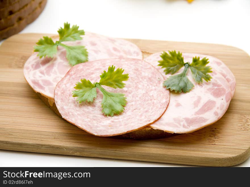 Wheat bread with sausage and parsley