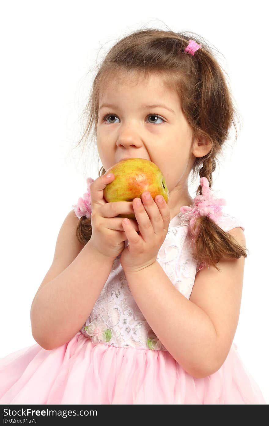 Beautiful little girl with pigtails eating apple. Beautiful little girl with pigtails eating apple