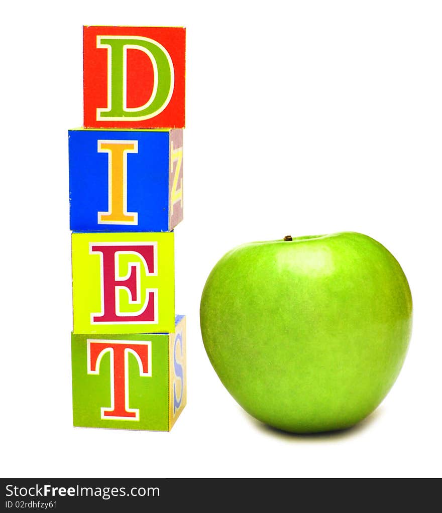 Green apple and cubes with letters - diet