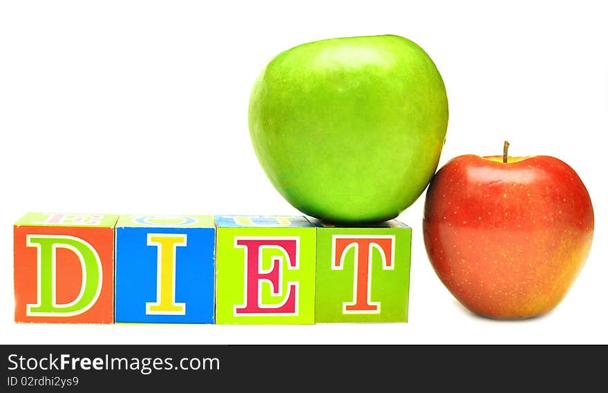 Green and red apple and cubes with letters - diet