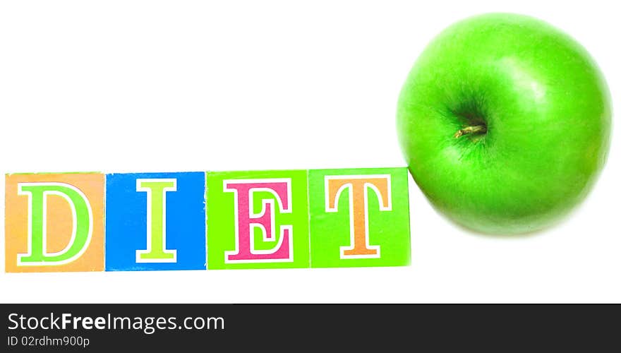 Green apple and cubes with letters - diet