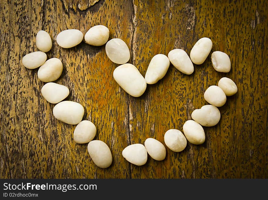 Heart on the wood background