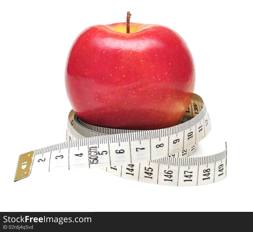 Tape measure wrapped around red apple