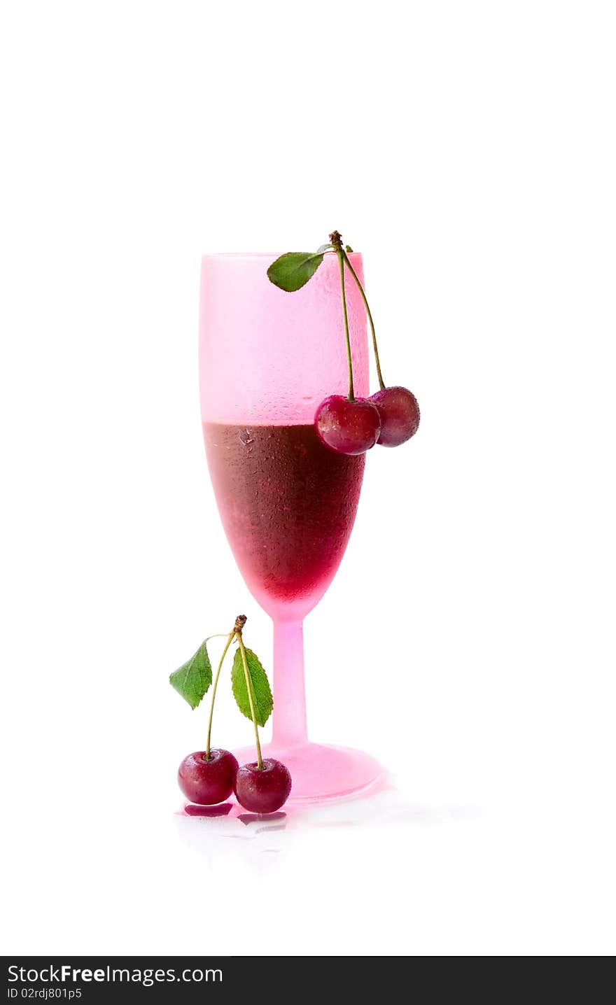 A glass of cherry juice on a white background