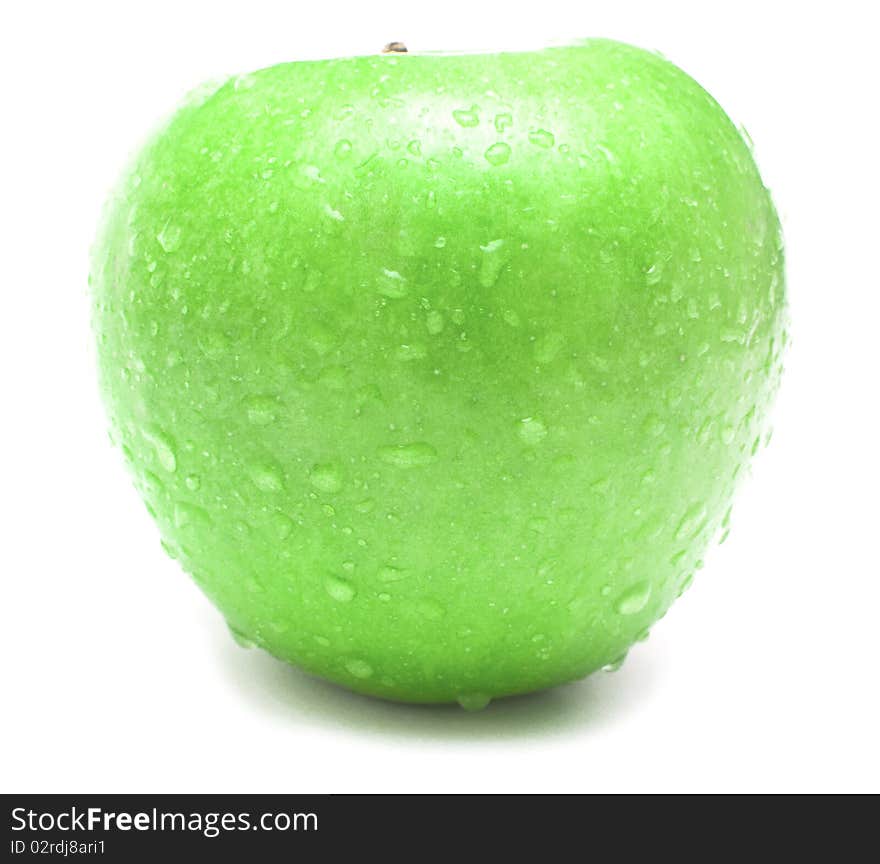 Wet green apple covered by water drops on white background. Isolation