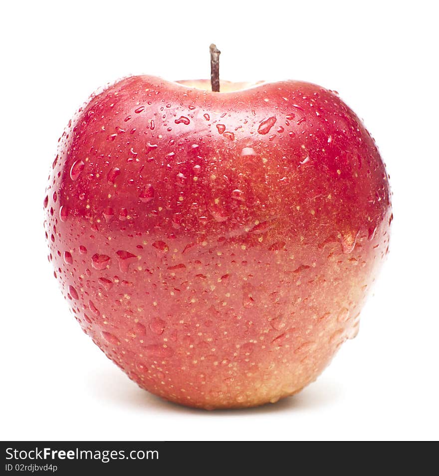 Wet red apple covered by water drops on white background. Isolation