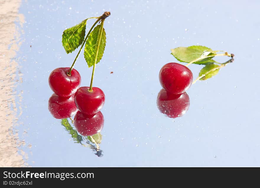 Reflection of wet berries on the mirror table. Reflection of wet berries on the mirror table