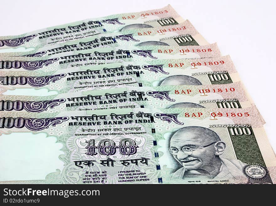 Indian money notes currency spread over white background