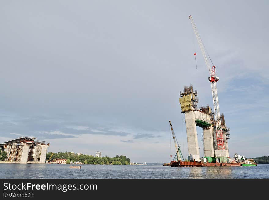 Building reinforced concrete bridge with highway on Dnepr river. Building reinforced concrete bridge with highway on Dnepr river