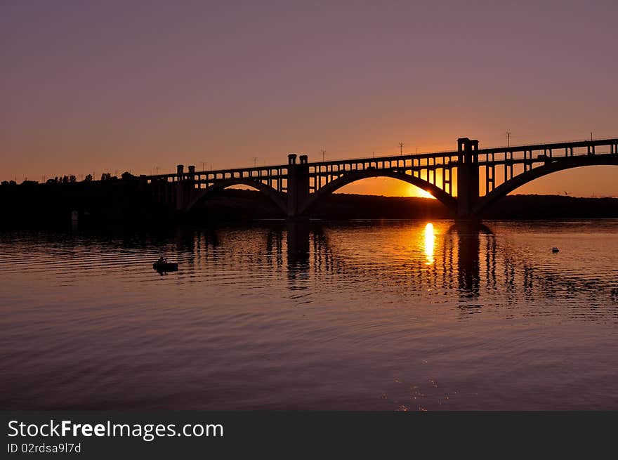 Sunset scene with bridge over the river. Sunset scene with bridge over the river