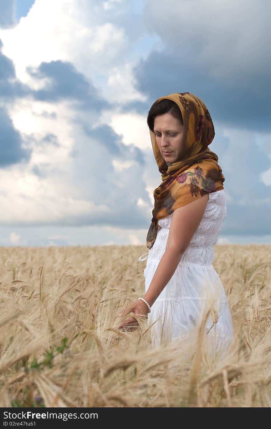 Women in white dress in the wheat field. Women in white dress in the wheat field