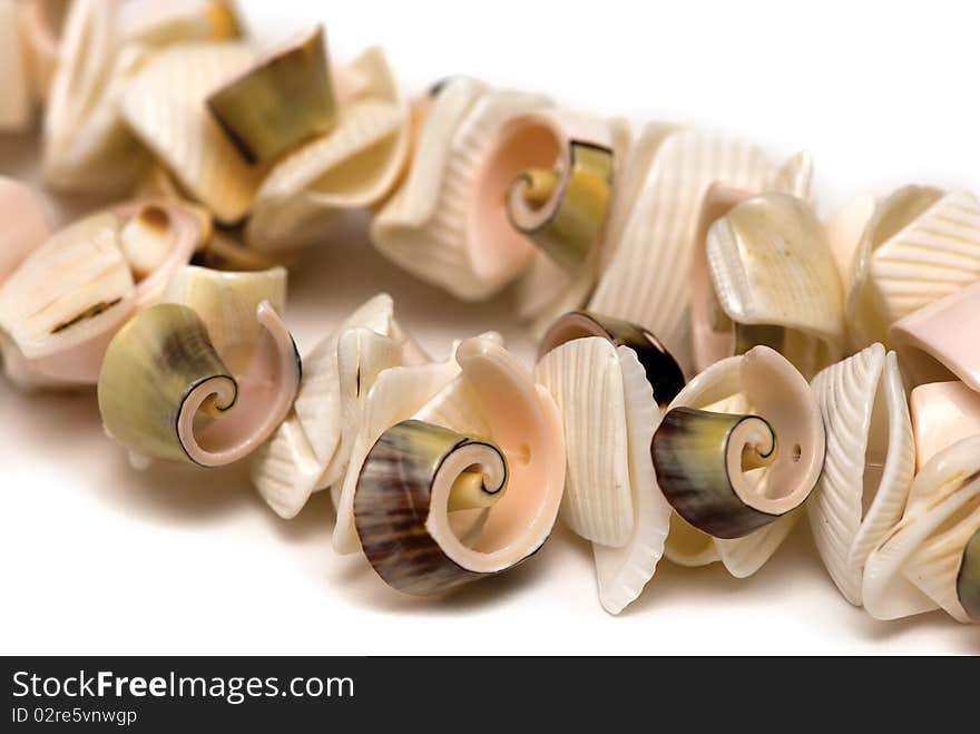 Beads from cockleshells on a white background