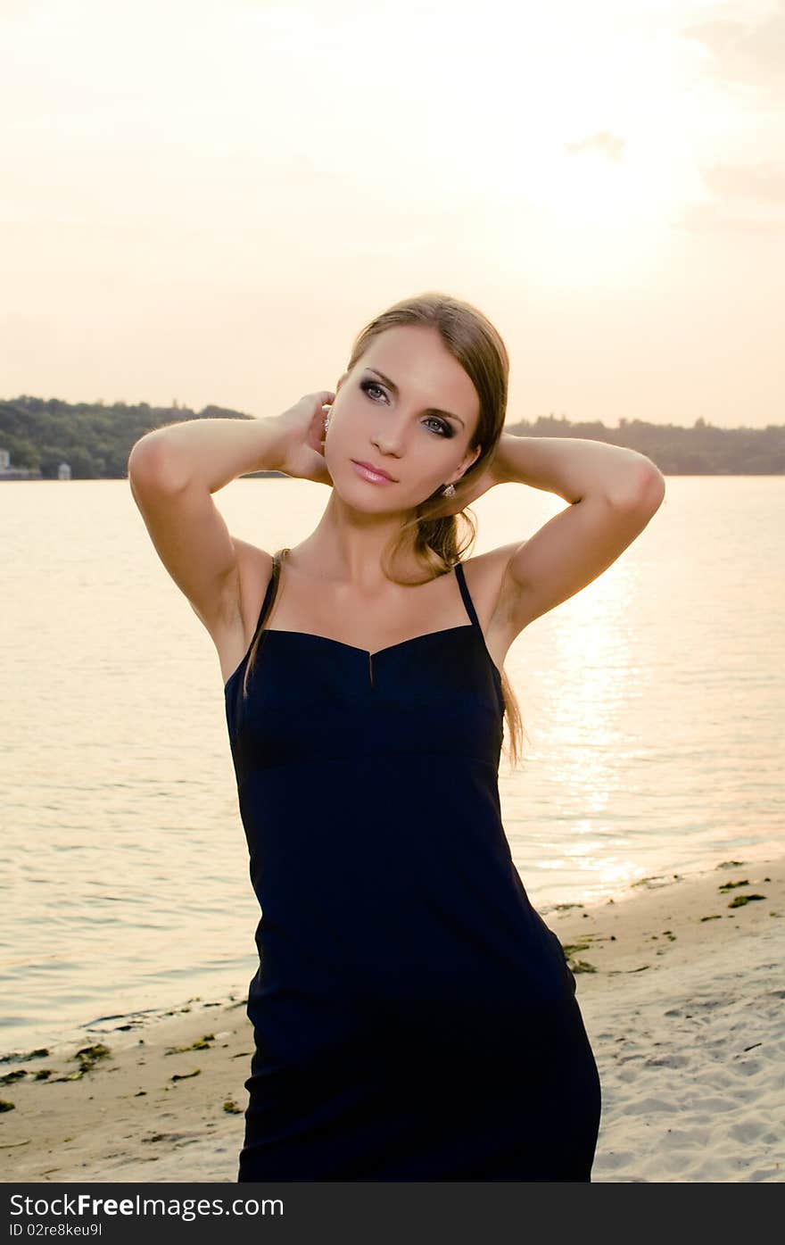 Beautiful woman on the beach during the sunset. Beautiful woman on the beach during the sunset