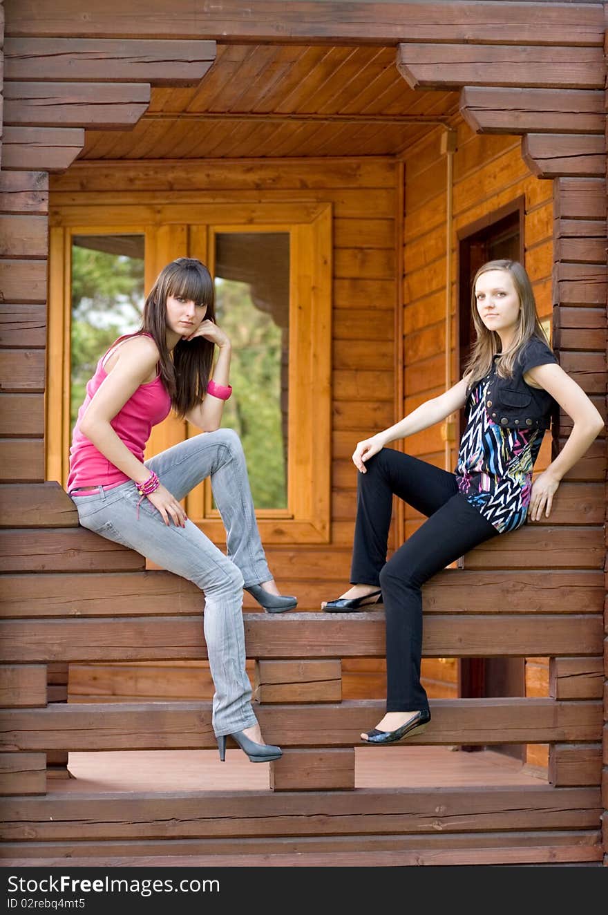 Two female friends on a veranda