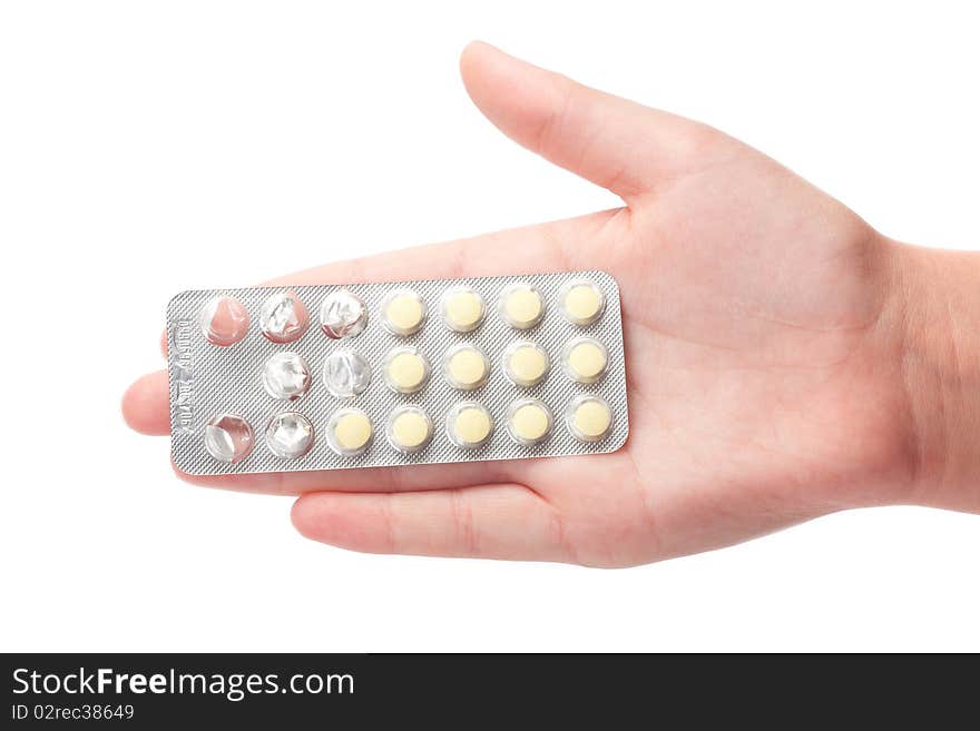 Medical pills container on a female hand, isolated on white