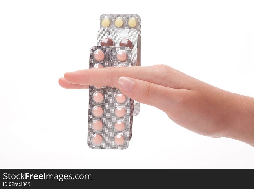 Three medical pills container on a female hand