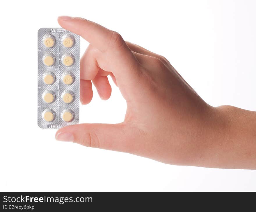 Medical pills container on a female hand, isolated