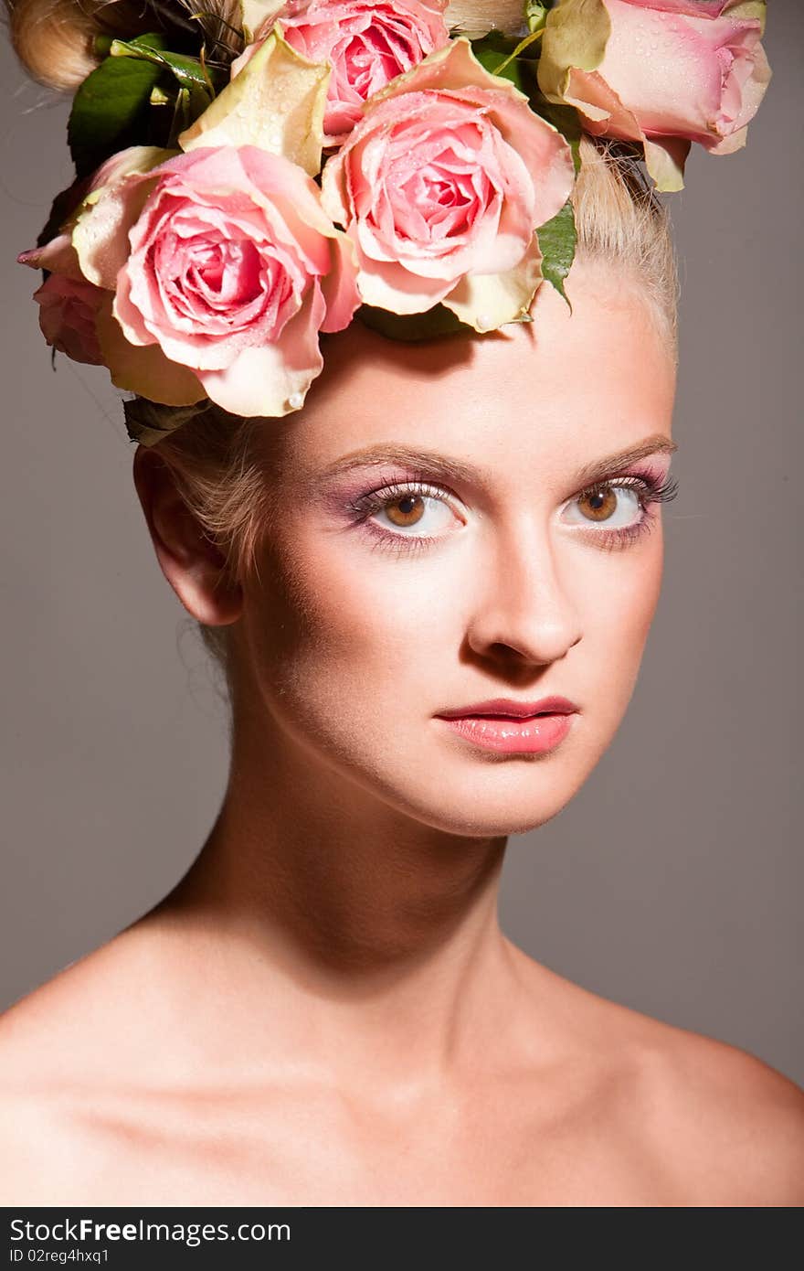 Beautiful blonde with a wreath of flowers