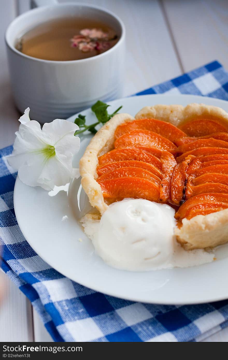 Apricot tart served with ice cream