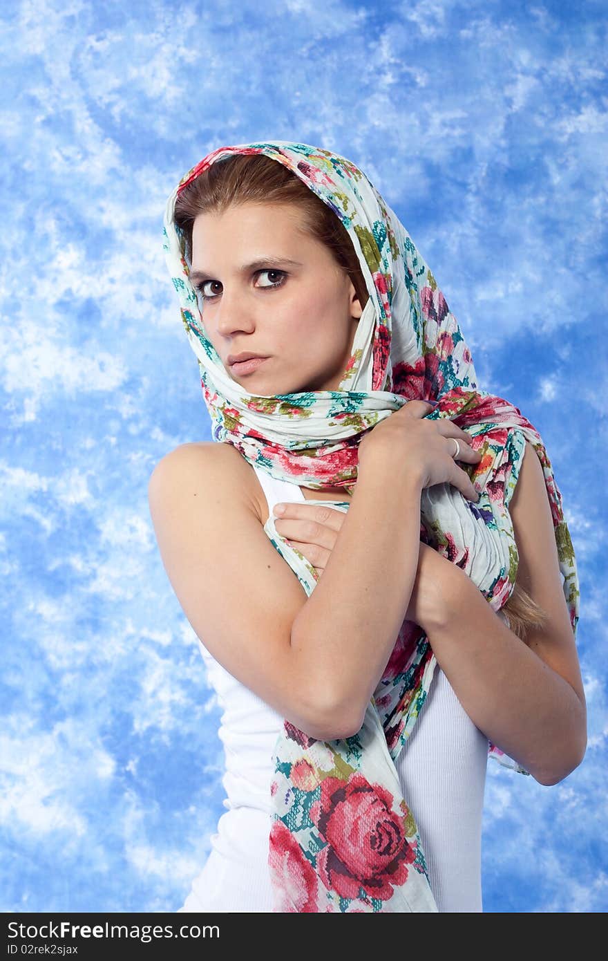 Female model posing with scarf over the head. Female model posing with scarf over the head