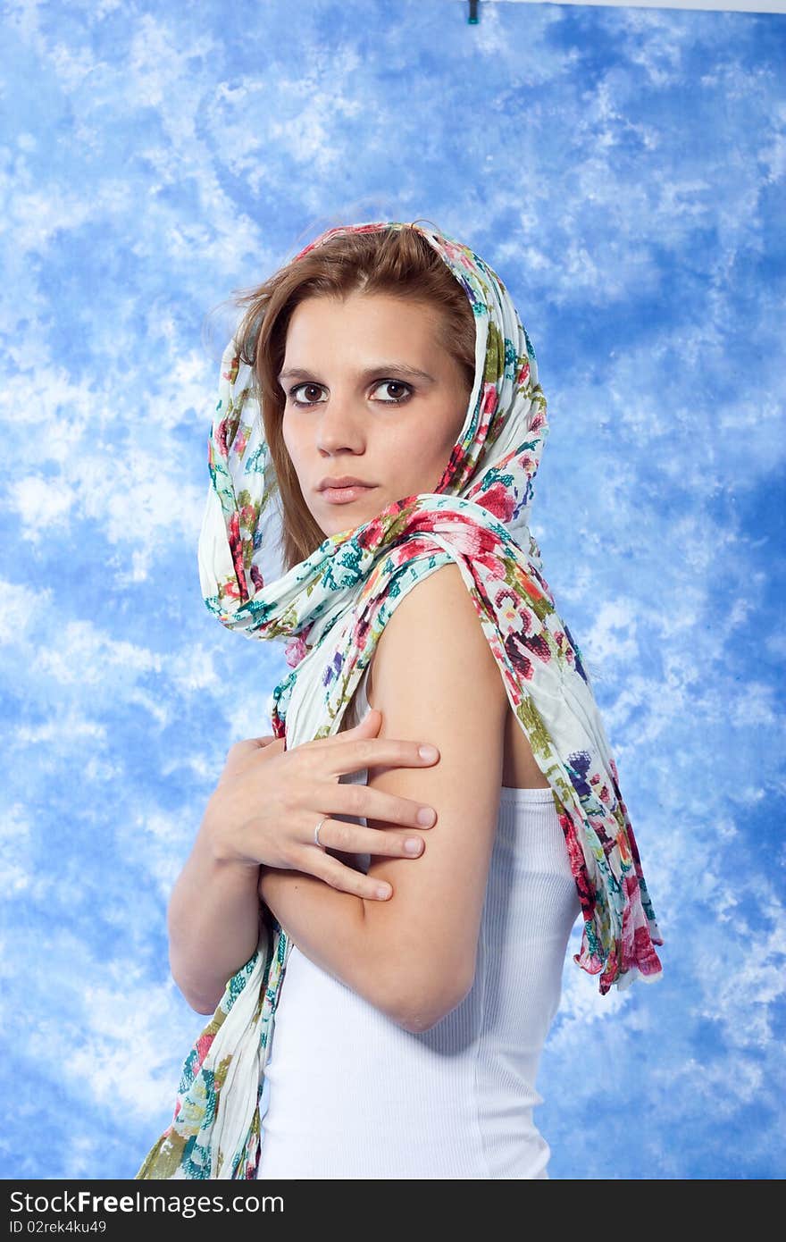 Female model posing with scarf over the head. Female model posing with scarf over the head