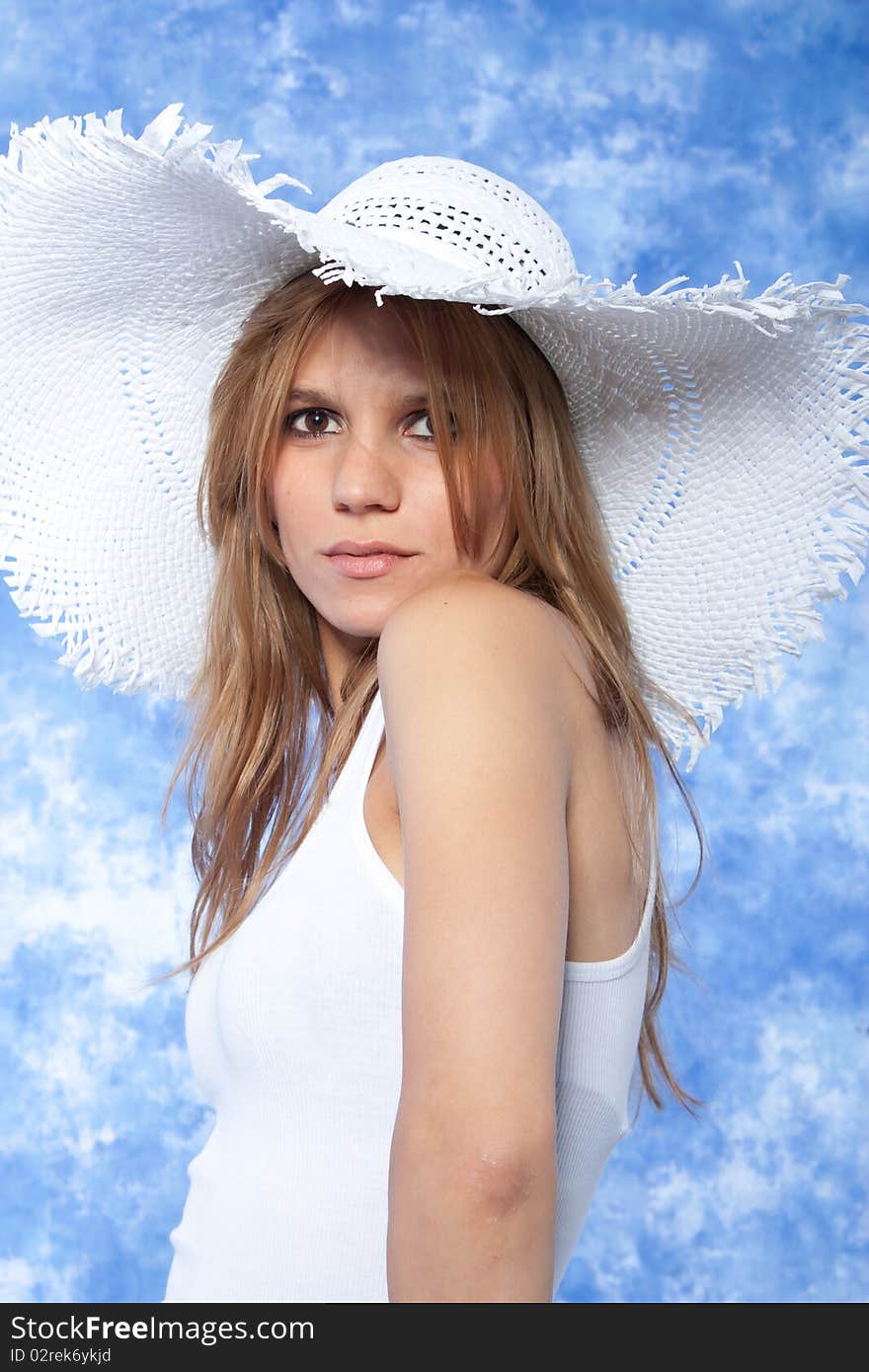 Female model posing with hat over the head. Female model posing with hat over the head