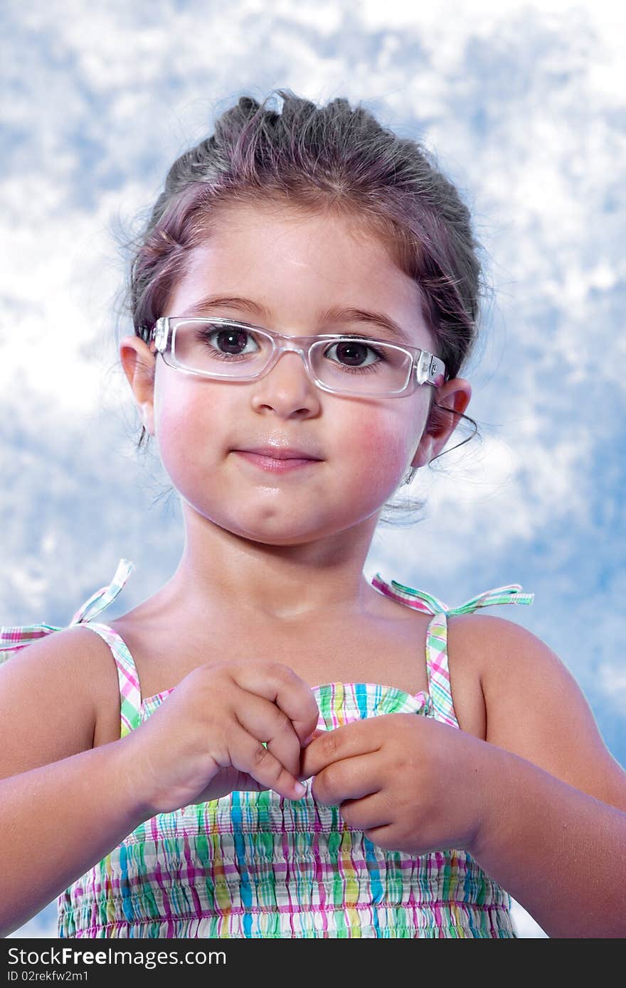 Beautiful Little Girl Unwrapping A Candy