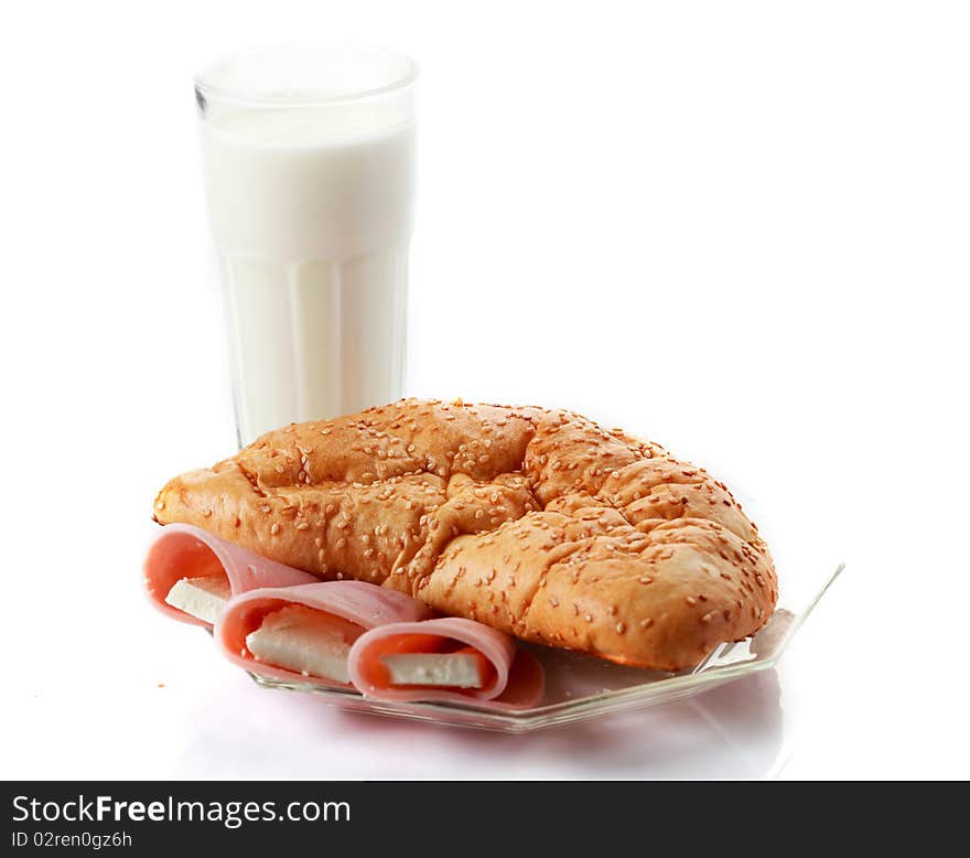 Closed pizza calzone with garnish and yogurt isolated on white. Closed pizza calzone with garnish and yogurt isolated on white