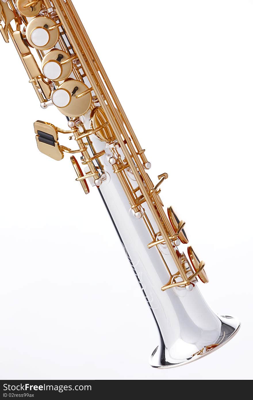 A professional soprano saxophone isolated against a white background in the vertical format. A professional soprano saxophone isolated against a white background in the vertical format.