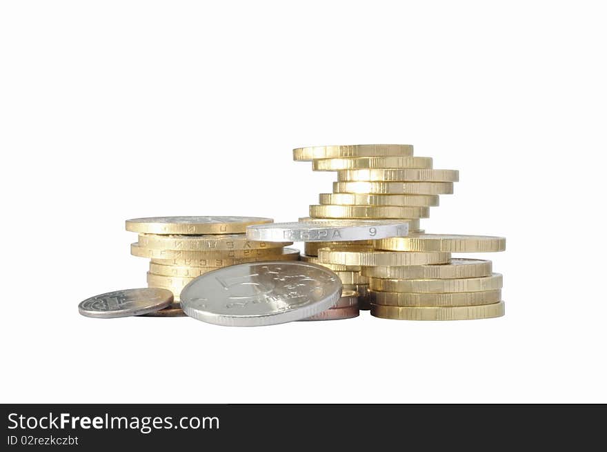 Piles of metal coins against white background. Piles of metal coins against white background