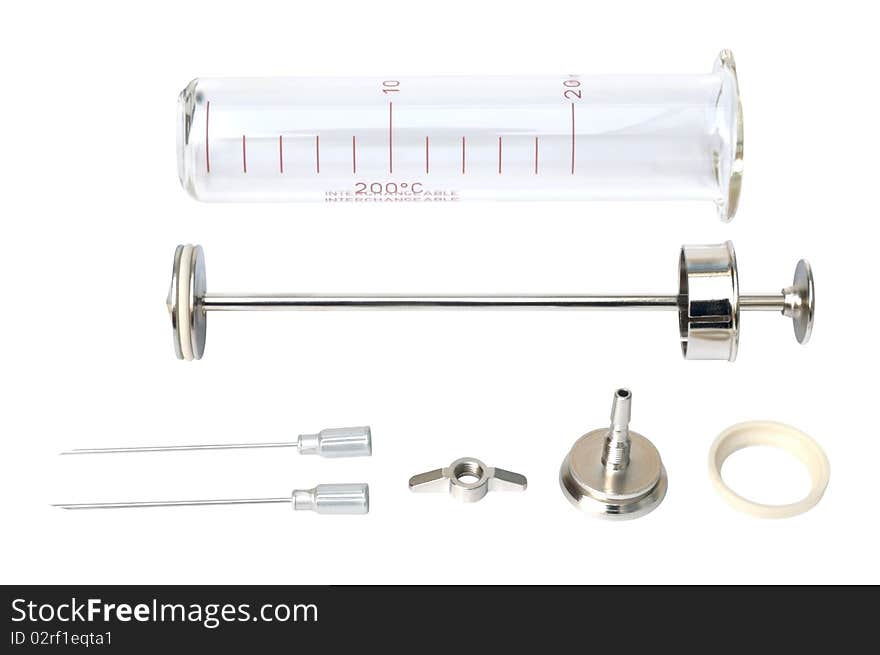 Old glass syringe against white background