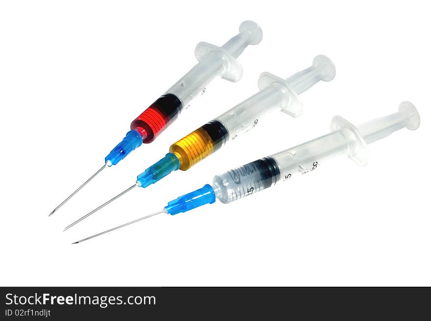 Three disposable plastic syringe against white background. Three disposable plastic syringe against white background