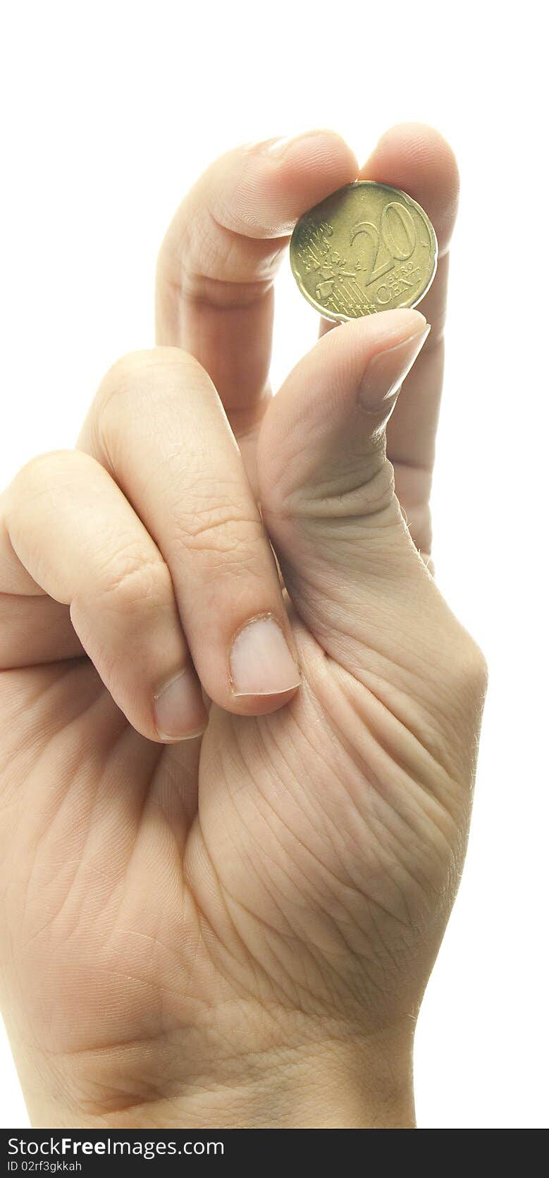 Hand holding coin on white background