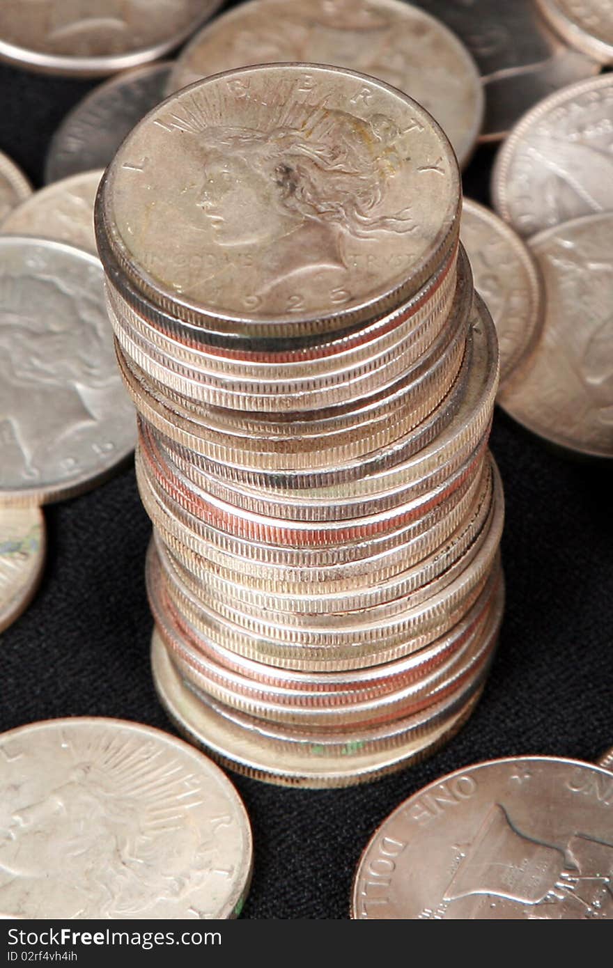 Focus On The Top Of A Stack Of Silver Dollars