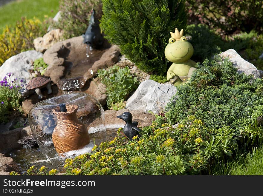 Detail of beautiful summer garden with water element