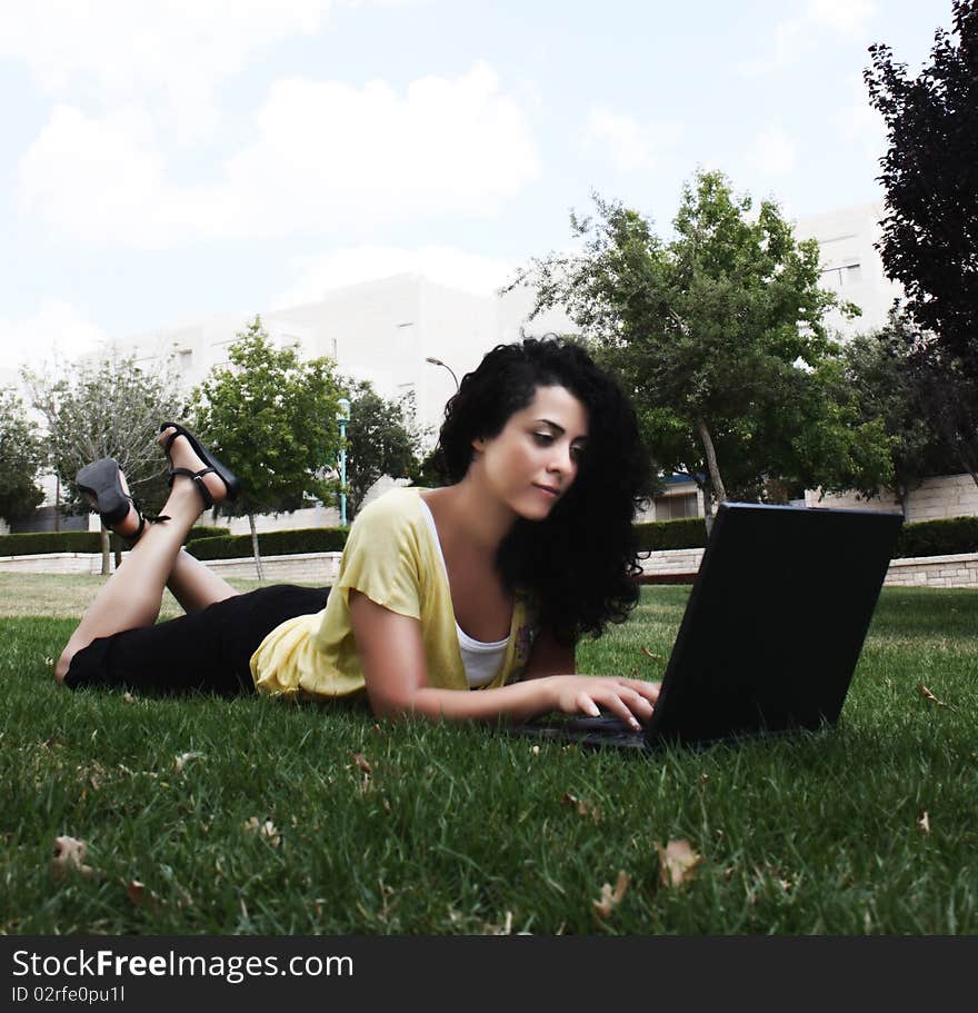 Beautiful young woman with laptop