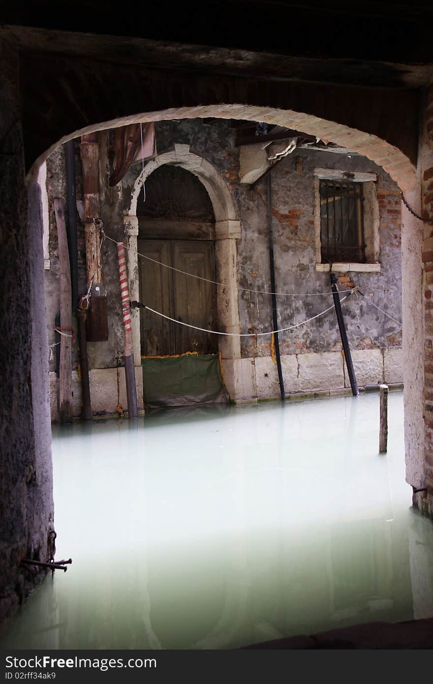 Looking through an arch way to one of Venice's many canals. Looking through an arch way to one of Venice's many canals.