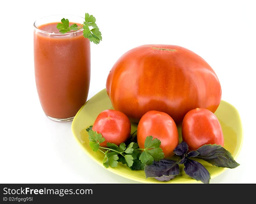 Big tomato with small tomatoes and juice