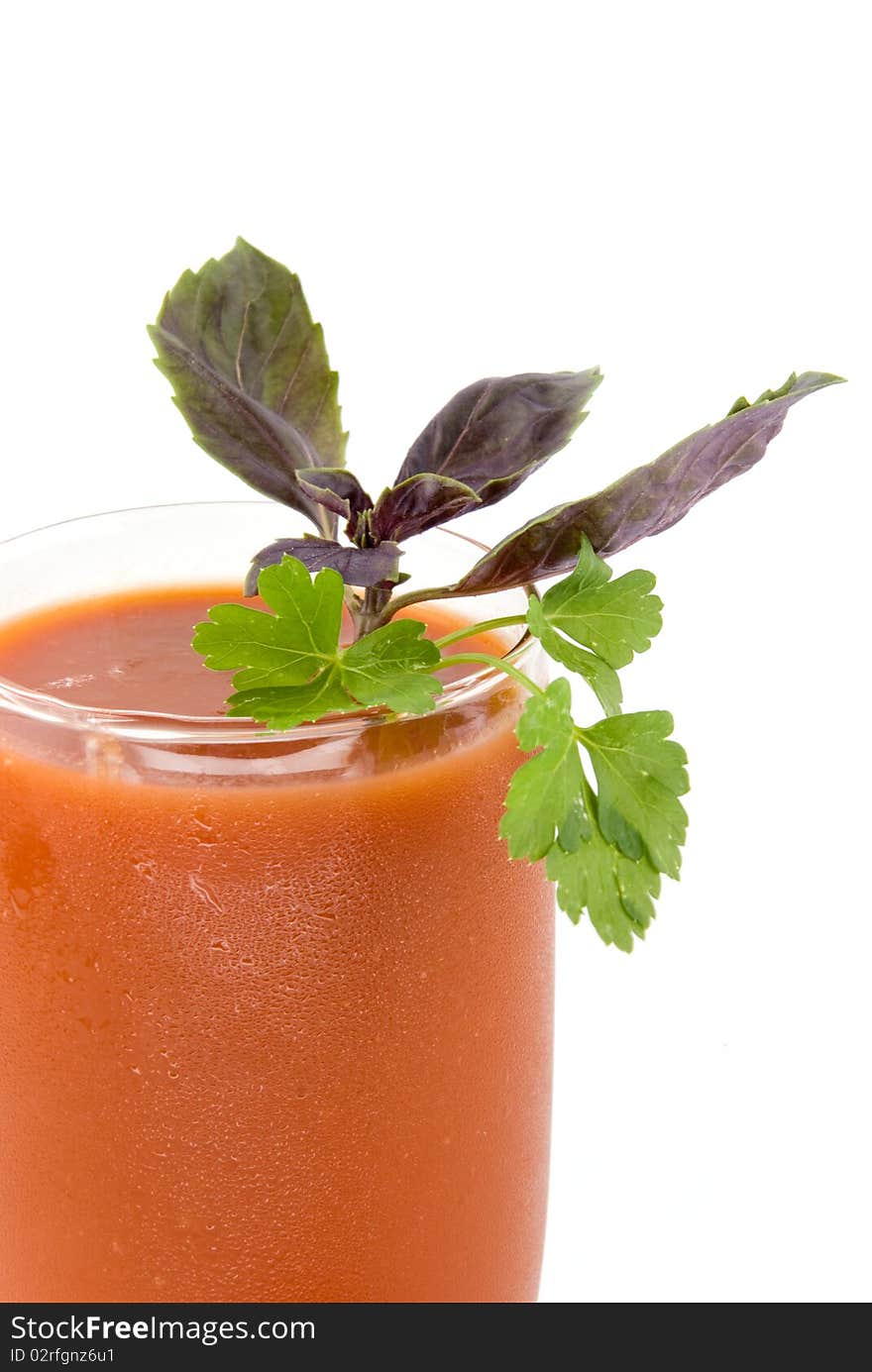 Tomato juice and greens on white background