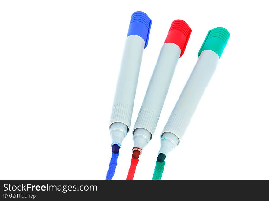 Three colored markers isolated on white background. Three colored markers isolated on white background