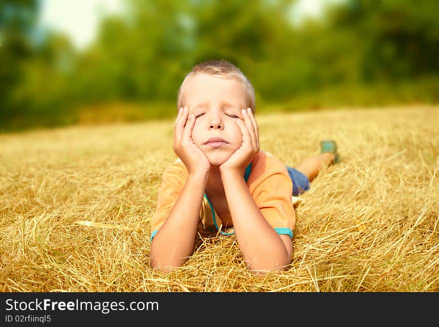 Young Boy Laying On Ground