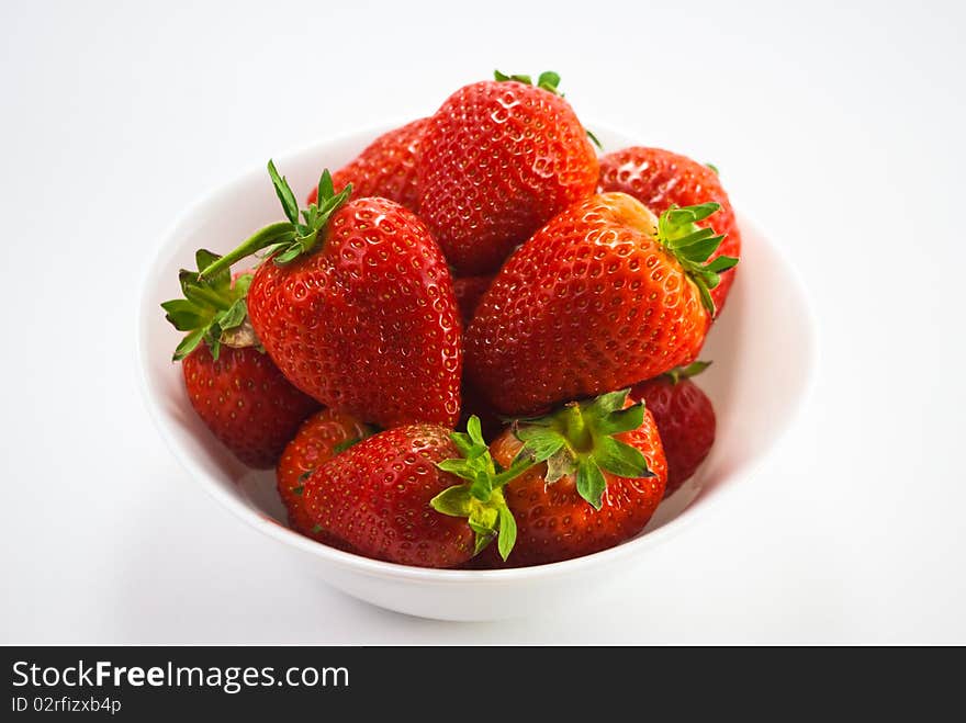 Strawberries in pot isolated on white