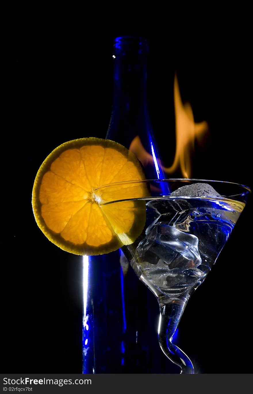 Cocktail with flame on the black background