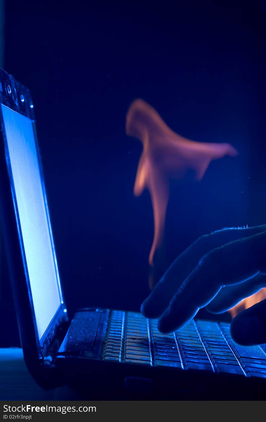 Laptop and human hand on blue background. Laptop and human hand on blue background