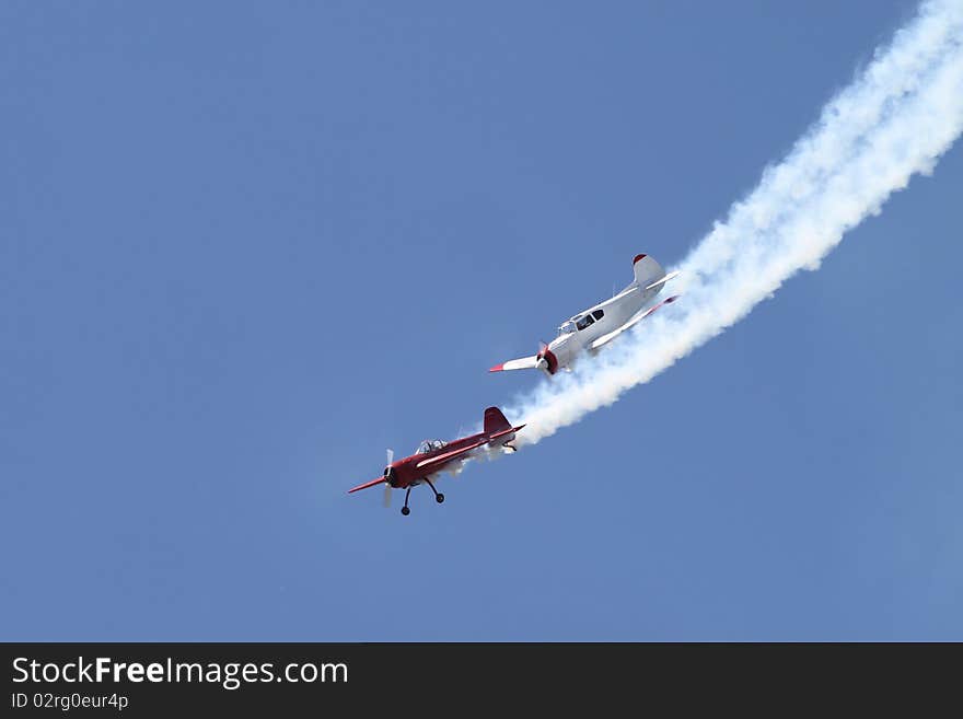 Two Planes Performing Aerobatic Stunts at Airshow